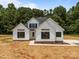 Charming new construction home featuring a modern farmhouse exterior and dark framed windows at 4975 Rimer Rd # 1, Concord, NC 28025