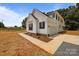 New construction featuring attached garage, concrete driveway, and sidewalk at 4975 Rimer Rd # 1, Concord, NC 28025