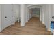 Hallway showing archway, bathroom and LVP flooring at 4975 Rimer Rd # 1, Concord, NC 28025