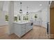 Spacious white kitchen featuring an island with quartz countertop and stainless steel appliances at 4975 Rimer Rd # 1, Concord, NC 28025