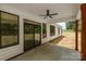 Covered patio with fan overlooking large backyard perfect for relaxing or entertaining at 4975 Rimer Rd # 1, Concord, NC 28025