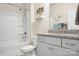 Bathroom featuring a tub and shower combination and granite countertop at 5058 Antebellum Dr, Iron Station, NC 28080