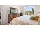 Cozy bedroom with view of the backyard, a wooden dresser, and decorative accents at 5058 Antebellum Dr, Iron Station, NC 28080