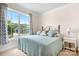 Bedroom featuring a wrought iron bed frame and natural light at 5058 Antebellum Dr, Iron Station, NC 28080