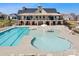 Community clubhouse featuring a pool, kiddie pool, and a large patio with plenty of seating at 5058 Antebellum Dr, Iron Station, NC 28080