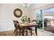 Traditional dining room featuring a wood table, chandelier, and sliding glass doors to an outdoor seating area at 5058 Antebellum Dr, Iron Station, NC 28080