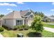 Well-kept home featuring stone accents, a neatly landscaped yard, and a view of the surrounding neighborhood at 5058 Antebellum Dr, Iron Station, NC 28080