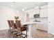 Well-appointed kitchen with a central island, stainless steel appliances, and barstool seating at 5058 Antebellum Dr, Iron Station, NC 28080