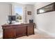 Cozy office space with a large wooden desk, natural light, and neutral tones creates a welcoming work environment at 5058 Antebellum Dr, Iron Station, NC 28080