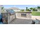 Outdoor kitchen featuring stone countertop and stainless steel appliances, perfect for outdoor entertaining and grilling at 5058 Antebellum Dr, Iron Station, NC 28080