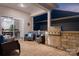 An outdoor patio featuring a built-in grill, lounge seating, and easy access to the home's interior at 5058 Antebellum Dr, Iron Station, NC 28080