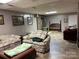 Open basement area with wood burning stove and paneled walls, perfect for entertaining at 5198 Wright Dr, Hickory, NC 28602