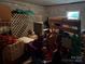 Dimly lit basement with stored items and concrete walls; opportunity to improve and use the space at 5198 Wright Dr, Hickory, NC 28602