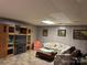 Basement with wood paneled walls, carpet floors, and a big television at 5198 Wright Dr, Hickory, NC 28602