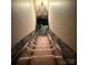 Carpeted staircase featuring unique and decorative trim at 5198 Wright Dr, Hickory, NC 28602