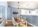 Open-concept living, dining room with a dining table, chairs, and modern pendant lighting at 556 Knighton Hill Rd, Rock Hill, SC 29732