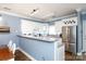Well-lit kitchen with white cabinets, countertop, and stainless steel appliances at 556 Knighton Hill Rd, Rock Hill, SC 29732