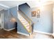View of staircase with wood handrail and white banisters at 556 Knighton Hill Rd, Rock Hill, SC 29732