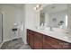 Bathroom with double sinks, a tile floor, and plenty of counter space at 6192 Kilchurn Dr, Fort Mill, SC 29707