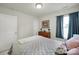 Comfortable bedroom features a large bed, dresser, and natural light from a window at 6192 Kilchurn Dr, Fort Mill, SC 29707