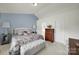 Bright bedroom with plush bedding, natural light, and ensuite bath access at 6192 Kilchurn Dr, Fort Mill, SC 29707