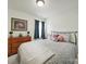 Inviting bedroom displaying natural light from a window with dresser and comfortable decor at 6192 Kilchurn Dr, Fort Mill, SC 29707