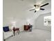 Spacious bonus room features a ceiling fan and natural light, ideal for home office at 6192 Kilchurn Dr, Fort Mill, SC 29707
