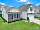 Attractive home features stone accents and well-maintained landscaping at 6192 Kilchurn Dr, Fort Mill, SC 29707