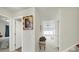Hallway with chair leads to a living space filled with lots of natural light at 6192 Kilchurn Dr, Fort Mill, SC 29707