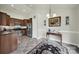 Well-equipped kitchen with stainless steel appliances, dark countertops, and adjacent dining space at 6192 Kilchurn Dr, Fort Mill, SC 29707