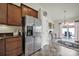 Spacious kitchen featuring stainless steel appliances, granite countertops, and access to the patio at 6192 Kilchurn Dr, Fort Mill, SC 29707