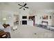 Spacious living room with fireplace, seamlessly connecting to the kitchen and dining areas at 6192 Kilchurn Dr, Fort Mill, SC 29707