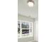 Neighborhood street view through a bright, sunlit window at 6192 Kilchurn Dr, Fort Mill, SC 29707