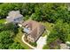 Aerial view of a lovely home surrounded by trees and a well-maintained lawn at 6300 Latta Springs Cir, Huntersville, NC 28078