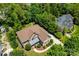 Aerial view of a beautiful home surrounded by green trees and a well-manicured lawn at 6300 Latta Springs Cir, Huntersville, NC 28078