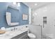 Modern bathroom with sleek fixtures, glass-enclosed shower, and stylish vanity, perfect for pampering and rejuvenation at 6300 Latta Springs Cir, Huntersville, NC 28078