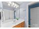 Well-lit bathroom with a single sink vanity and a view into a separate toilet room at 6300 Latta Springs Cir, Huntersville, NC 28078