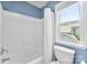 Clean bathroom with a shower/tub combo and an exterior view at 6300 Latta Springs Cir, Huntersville, NC 28078