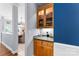 Convenient Butler's pantry with a display cabinet at 6300 Latta Springs Cir, Huntersville, NC 28078