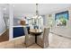 Inviting dining area with natural light and seating for four, perfect for casual meals and entertaining guests at 6300 Latta Springs Cir, Huntersville, NC 28078