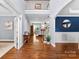 Bright foyer with hardwood floors, high ceilings, and staircase at 6300 Latta Springs Cir, Huntersville, NC 28078