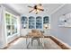 Inviting home office with built-in bookshelves and a large window at 6300 Latta Springs Cir, Huntersville, NC 28078