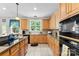 Well-equipped kitchen with ample cabinetry and counter space, ready for culinary adventures and everyday cooking at 6300 Latta Springs Cir, Huntersville, NC 28078