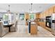 Well-lit kitchen featuring a tile floor, breakfast nook, and stainless steel appliances at 6300 Latta Springs Cir, Huntersville, NC 28078