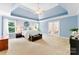 Expansive main bedroom with tray ceiling, offering a luxurious retreat for relaxation and rest at 6300 Latta Springs Cir, Huntersville, NC 28078
