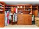 Spacious walk-in closet with custom wood shelving and drawers at 6300 Latta Springs Cir, Huntersville, NC 28078