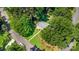 Aerial view showcases lush landscaping surrounding a well-maintained home in a peaceful neighborhood at 7015 Lavern St, Charlotte, NC 28215