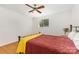 Bedroom featuring hardwood floors, window, and a comfortable-looking bed at 7015 Lavern St, Charlotte, NC 28215