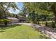 A traditional two-story home with a charming driveway, attached garage, and inviting curb appeal at 7015 Lavern St, Charlotte, NC 28215
