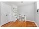 A small, home office with desk, built in shelves and hardwood floors at 7015 Lavern St, Charlotte, NC 28215